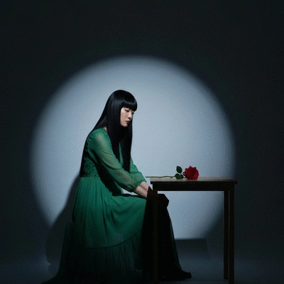 Woman enjoying a clean, organized, and plant-filled home office space